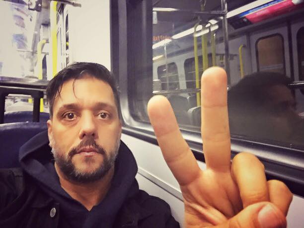 Spotted: George Strombo Takes A Selfie On The Skytrain