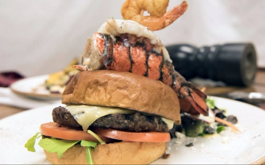 burger topped with lobster