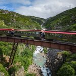 Canada’s Most Scenic Train Ride Takes You Along Massive Mountains & Beautiful Waterfalls